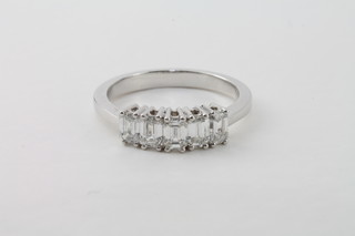 An 18ct white gold dress/engagement ring set baguette cut diamonds, approx 1.01ct