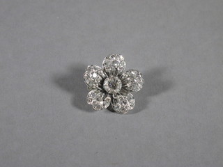 A diamond set floral shaped brooch