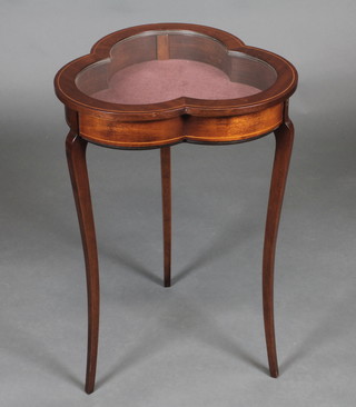 A clover shaped inlaid mahogany bijouterie table raised on cabriole supports 17"