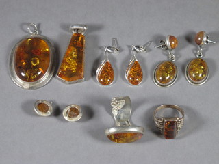 A collection of silver mounted jewellery comprising 2 rings, 2 pendants and 3 pairs of earrings