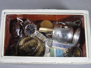 A collection of various bank notes, curios, watches etc