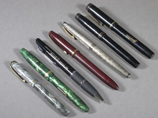 A Burnhan 40 fountain pen, a Conway Stewart no.45 fountain  pen, do. 85L fountain pen, a red fountain pen, a black The De  La Pue pen, a Schaefer silver cased fountain pen and a ball point  pen