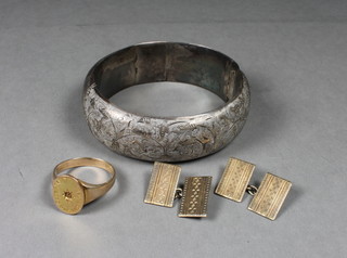 A 9ct gold signet ring, a pair of gilt metal cufflinks and an engraved Sterling silver bracelet