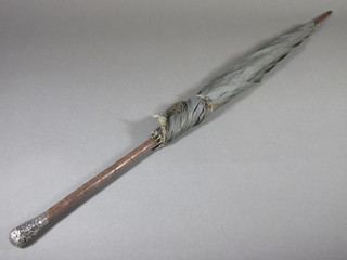 A lady's umbrella with bamboo handle and silver mount