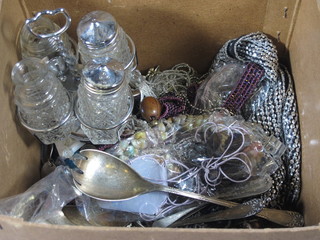 A glass 4 bottle condiment set and a small collection of flatware  and costume jewellery