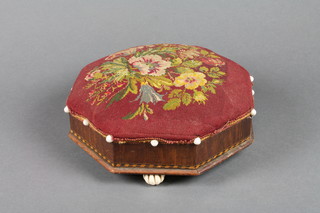 A Victorian octagonal inlaid walnut stool with wool work seat,  raised on ceramic bun feet 12"