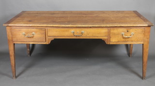 A Continental elm writing table fitted 1 long and 2 short drawers,  raised on square tapering supports 69"