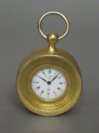 A French 8 day Sedan style alarm clock with enamelled dial  marked L E Marais contained in a gilt case 4"