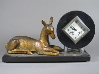 A French Art Deco striking mantel clock with diamond shaped silver dial, contained in a marble and spelter case decorated a  figure of a reclining fawn, 19"