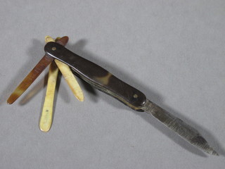 An 18th/19th Century folding pocket hygiene knife with 3  spatulas and steel blade with "tortoiseshell" mount