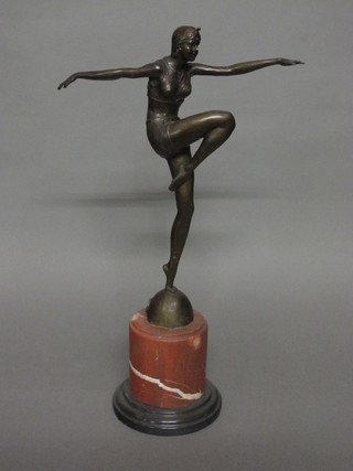 An Art Deco style bronze figure of a dancing girl raised on a  turned and marble base 22"