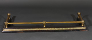 A Victorian iron and brass railed fire curb 49"