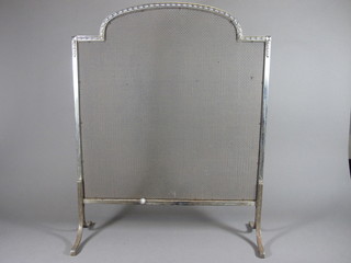 A polished steel and mesh spark guard 22"