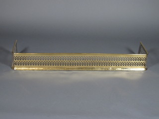 A Victorian pierced brass fender 48"