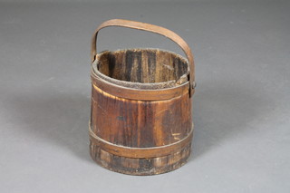 A turned wooden bucket with swing handle 11 1/2"