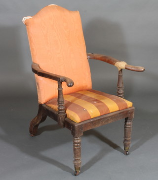 A 19th Century mahogany open armchair with upholstered seat  and back, raised on turned supports