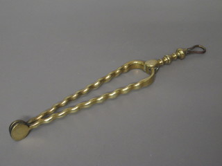 A pair of 19th Century brass fire tongs