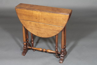 A Victorian oval mahogany Sutherland table raised on turned supports 23"