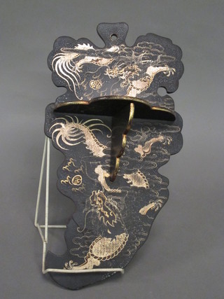 An Oriental lacquered folding wall bracket 8"
