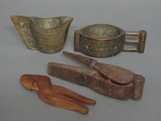 A carved oval hardwood jug 7", do. mug, a pair of nut crackers  and an inkwell