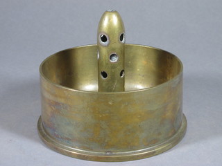A WWII Trench Art ashtray formed from the base of a shell
