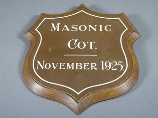 A copper and enamelled shield shaped plaque marked Masonic  Cot, November 1925, 10"