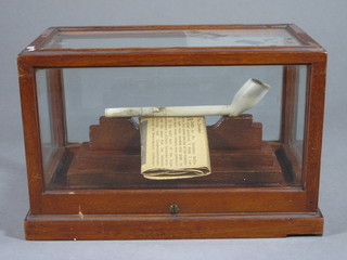 A South African clay pipe contained in a glazed mahogany case  9"