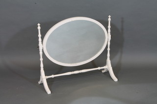 A 19th Century oval plate dressing table mirror contained in a white painted frame 22"