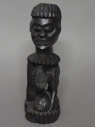 An Eastern carved ebony figure 11"