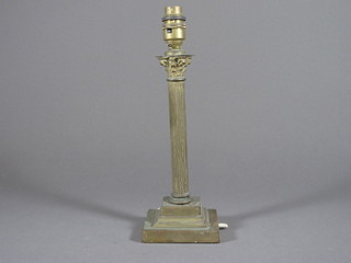 A reeded brass table lamp with Corinthian capital 10"