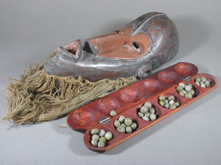 A carved African Tribal mask together with an oval box