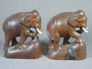 A pair of carved wooden figures of elephants 7 1/2"