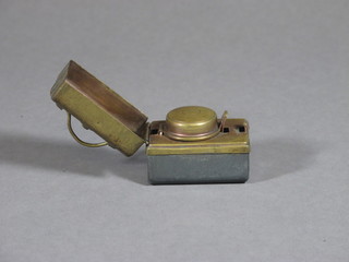 A brass and metal ink well in the form of a Gladstone bag 2"