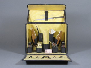 A 1930's manicure set contained in a leather carrying case