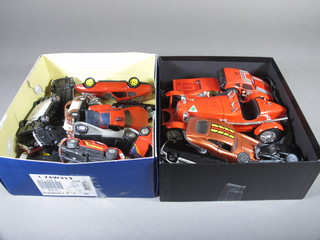 2 shallow boxes containing a collection of toy cars