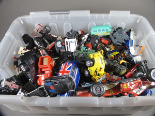 A large plastic crate containing a collection of toy cars