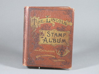 A collection of various World stamps contained in a red Lincoln  album
