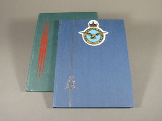 A blue stock book of various Air Force related stamps and a green stock book of British stamps