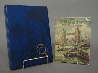 The Trusty album of various stamps and a green loose leaf album of various stamps