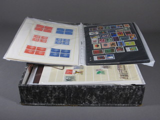 A box file containing a collection of loose stamps