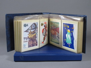 A collection of various stamp postcards in 2 albums