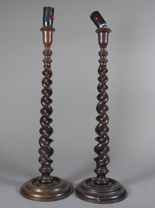 A pair of spiral turned mahogany candlesticks converted for use  as table lamps 21"