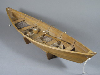 A wooden model of a fishing boat 29"