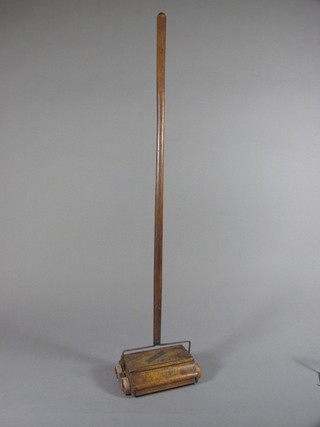 A childs vintage Bissell Baby carpet sweeper