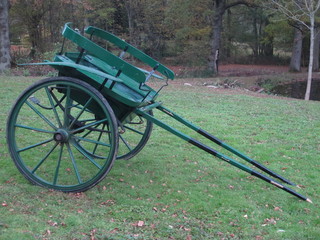 A green and black painted Irish Governesses cart, circa 1910,   ILLUSTRATED