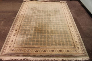 A green ground machine made rug 108" x 79"