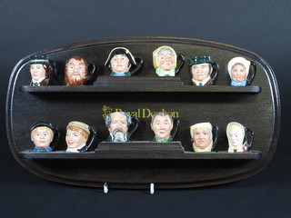 A set of 12 tiny Royal Doulton Dickens character jugs - David Copperfield, Fagin, Mr Bumble, Mrs Bardell, Bill Sykes, Betsy  Trotwood, Little Nell, Scrooge, Uriah Heep, Charles Dickens,  Artful Dodger and Oliver Twist, bases marked D6677 1"
