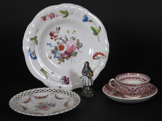An 18th Century circular porcelain plate with floral decoration  8", a German plate with floral decoration 4", a red glazed cup  and saucer and a small porcelain figure the base with anchor  mark 3"