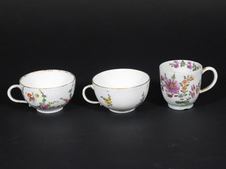 2 "Meissen" porcelain cups decorated flowers, the bases with  crossed sword mark and an Oriental cup