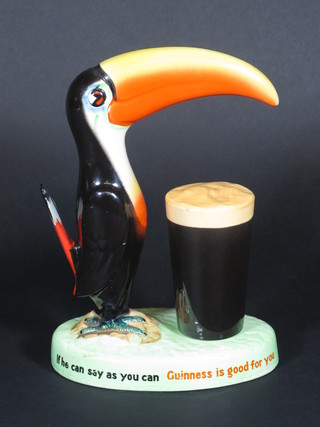 A Wiltshaw and Robinson Guiness advertising figure in the form  of a standing Toucan and pint of Guiness, tail f and r, 8"   ILLUSTRATED